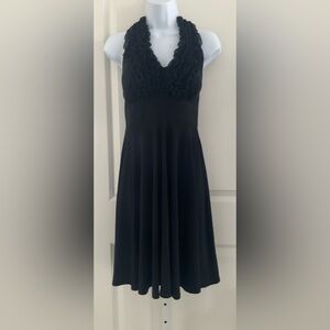 Onyx Black Halter Cocktail Ruffle Dress.
Size 4.
Padded Bra.
Excellent Condition